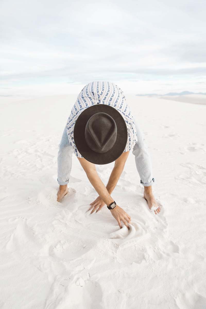 white sands person standing on sand crawling